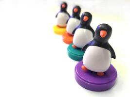 a group of penguin toys isolated on white background. copy space for text. Holiday season themes background photo