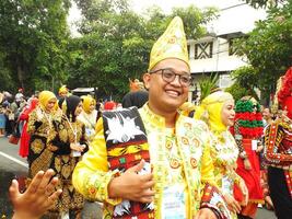 Surakarta City, Central Java, Indonesia, May 15, 2024. Tourist attraction on a traditional costume parade at Slamet Riyadi Street. photo