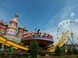 Sumedang, West Java, Indonesia, May 24, 2024. view landscape of a tourist spot called Jatinangor amusement Park, with magnificent and beautiful building with colorful paint photo