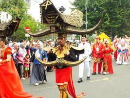 Surakarta City, Central Java, Indonesia, May 15, 2024. Tourist attraction on a traditional costume parade at Slamet Riyadi Street. photo