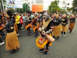 Surakarta City, Central Java, Indonesia, May 15, 2024. Tourist attraction on a traditional costume parade at Slamet Riyadi Street. photo