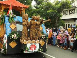 Surakarta City, Central Java, Indonesia, May 15, 2024. Tourist attraction on a traditional costume parade at Slamet Riyadi Street. photo