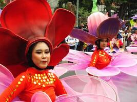 Surakarta City, Central Java, Indonesia, May 15, 2024. Tourist attraction on a traditional costume parade at Slamet Riyadi Street. photo