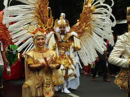 Surakarta City, Central Java, Indonesia, May 15, 2024. Tourist attraction on a traditional costume parade at Slamet Riyadi Street. photo
