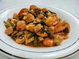 Stir-fry tempeh shrimp, focus of Spicy tempeh cooked in Indonesian styles. Stir fried slicy tempeh,seasoning with shrimp paste with chilies photo