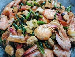 Stir-fry tempeh shrimp, focus of Spicy tempeh cooked in Indonesian styles. Stir fried slicy tempeh,seasoning with shrimp paste with chilies photo