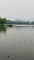 A floating boat on the background of the mountain video