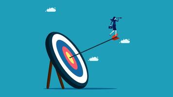 businessman on target with arrow in the center of the target vector