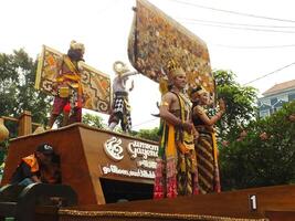 Surakarta City, Central Java, Indonesia, May 15, 2024. Tourist attraction on a traditional costume parade at Slamet Riyadi Street. photo