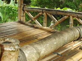 Traditional Bamboo Gazebo in shade under the trees. a relaxing place to unwind photo