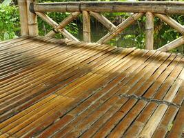 Traditional Bamboo Gazebo in shade under the trees. a relaxing place to unwind photo