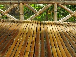 Traditional Bamboo Gazebo in shade under the trees. a relaxing place to unwind photo