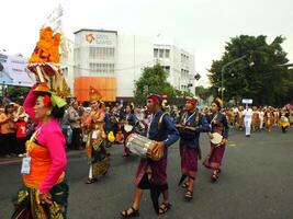 Surakarta City, Central Java, Indonesia, May 15, 2024. Tourist attraction on a traditional costume parade at Slamet Riyadi Street. photo