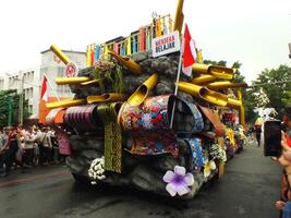 Surakarta City, Central Java, Indonesia, May 15, 2024. Tourist attraction on a traditional costume parade at Slamet Riyadi Street. photo