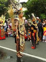 Surakarta City, Central Java, Indonesia, May 15, 2024. Tourist attraction on a traditional costume parade at Slamet Riyadi Street. photo