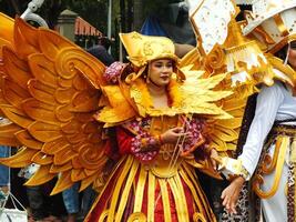 Surakarta City, Central Java, Indonesia, May 15, 2024. Tourist attraction on a traditional costume parade at Slamet Riyadi Street. photo