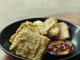Traditional Indonesian snack, tempe mendoan made from soybeans with savory taste. photo