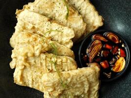 Traditional Indonesian snack, tempe mendoan made from soybeans with savory taste. photo