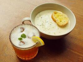 delicious of a bowls of cream soup with garlic bread. Europe cuisine for breakfast. photo