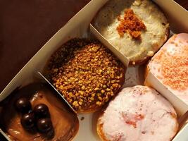 Delicious assorted various of donuts with cream, powder glazes and toppings. National donuts day concept. Doughnuts cake. Food and beverage image for coffee shop and restaurant business photo