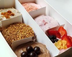 Delicious assorted various of donuts with cream, powder glazes and toppings. National donuts day concept. Doughnuts cake. Food and beverage image for coffee shop and restaurant business photo