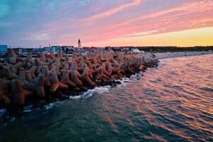 Tetrapod breakwater at sea coast for protecting from waves photo