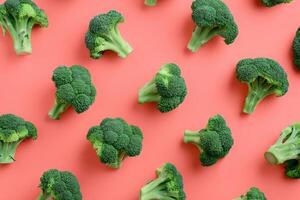 Pattern with Fresh Green Broccoli Florets on Red Background photo
