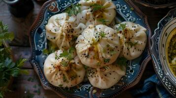 appetizing khinkali dumplings with herbs photo