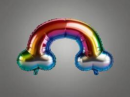 A foil balloon shaped like a rainbow with vibrant colors, floating against a gray background. photo