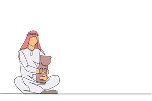 Single continuous line drawing of young energetic Arabian man sitting cross-legged hugging a little cat. Joking with beloved cat is one way to get rid of fatigue. One line design illustration vector