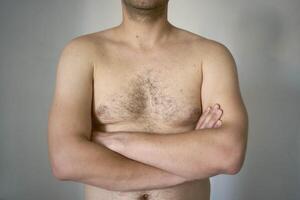 chest and stomach of a thirty-year-old with average build photo