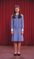photo of beautiful woman in restro hair and retro costume in t.v. series,