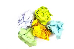 Crumpled and torn color paper isolated on white photo