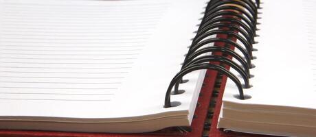 Close up of an open spiral notebook. Banner view photo