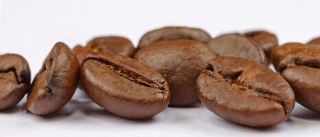 Panoramic view of coffee beans on white background photo