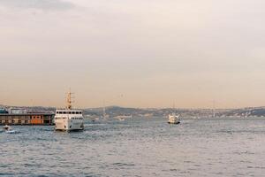 Traffic in the waters of the Bosphorus. Regular traffic of various watercraft from the port in Istanbul. photo