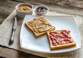 Sandwiches with peanut butter and strawberry jelly photo