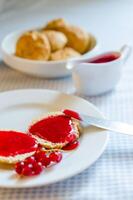 scone with redcurrant jam photo