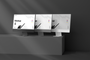 Realistic Triple Computer Desktop Mockup with Wall Background psd