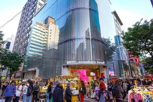 Seoul, South Korea- OCT 15, 2023, Street view in Myeongdong waling street. Myeongdong is an area of plaza, shopping mall, and street food. photo