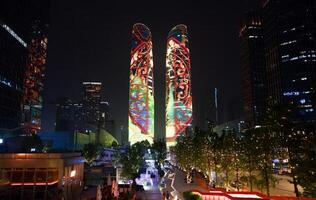 Jiaozi bridge and illuminated twin towers in night time, one of famous landmark in Chengdu. photo