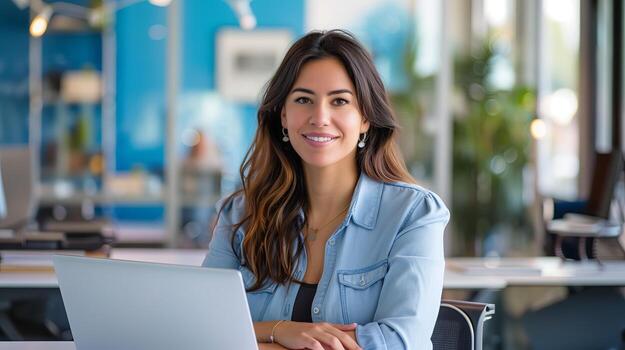 modern businesswoman displaying confidence, seated at a desk with a computer, modern office space photo