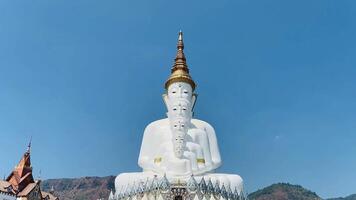 The big white Buddha five statue,Phetchabun is one of the top Thailand famous temples with a huge five white jade buddhas layered statue,Wat Phra That Pha Kaew, Phetchabun,Five white Buddha statue. video