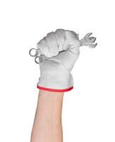 Hand with spanner in fist. White glove symbolizing work and protection. Isolated arm of man in photo