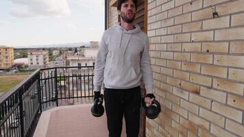 Man Does Sports Weightlifting On Balcony At Home video