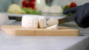 Mozzarella Caciocavalo Filling molds for the production of soft cheese. The cheese blanks are soaked in brine. Cheese factory preparing cheese video