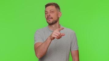 Handsome man smiling excitedly and pointing to camera, choosing lucky winner, indicating awesome you video