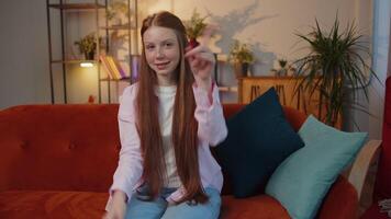 Redhead child girl smiling, pointing to camera, choosing lucky winner, indicating, inviting, approve video