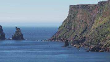 Aerial view of the Rynisfjara black sand beach in Iceland. Black sand beach and Reynisdrangar stack rocks of Vik i myrdal, Iceland. Famous basalt rocks on black sand beach near Vik video