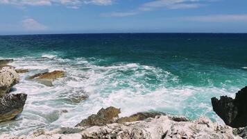 Serenitys Edge. A Glimpse of the Turquoise Sea Experience the raw power and beauty of the ocean as turquoise waves crash against the rocky cliff. video